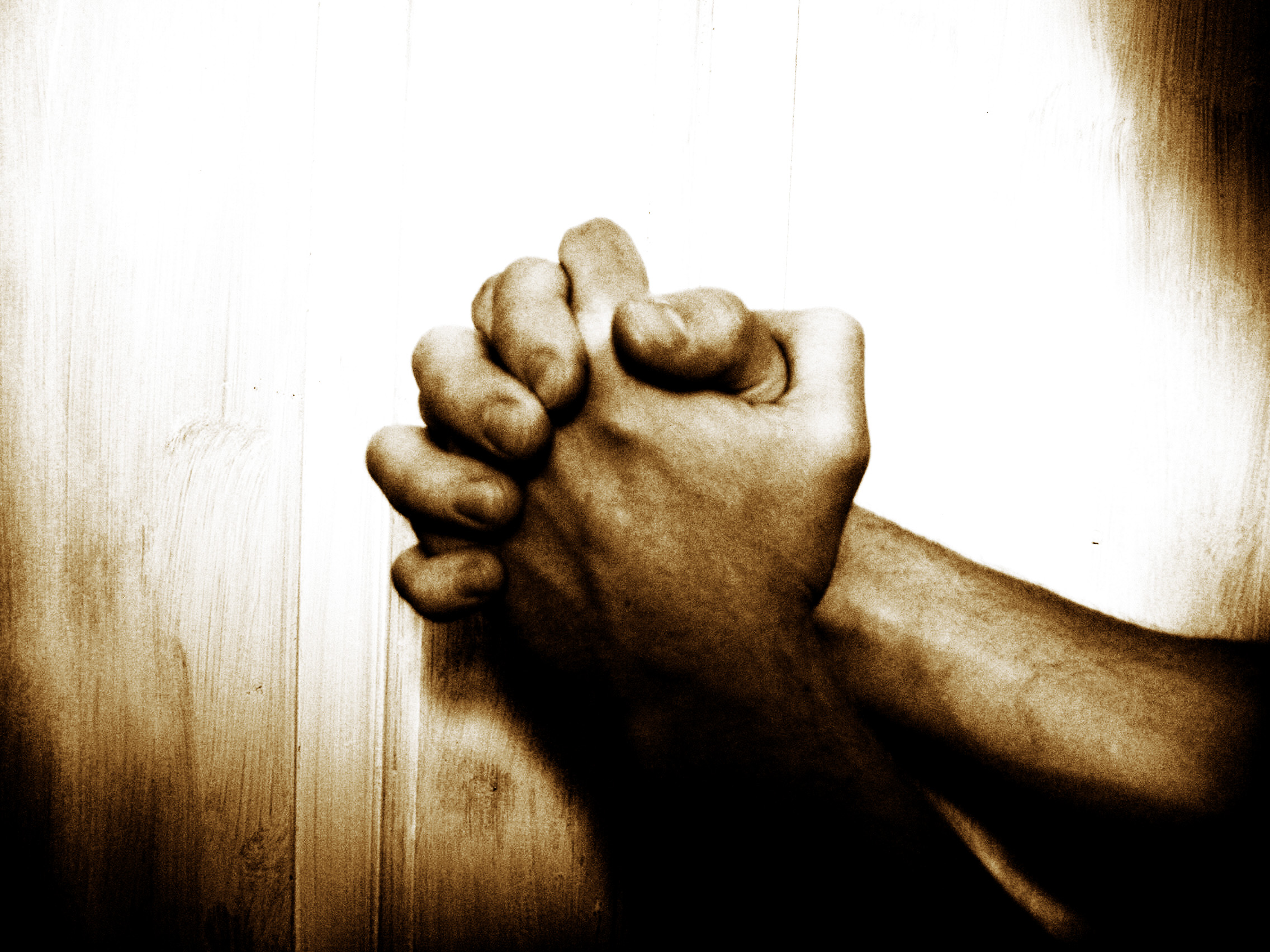 Hands clasped in prayer